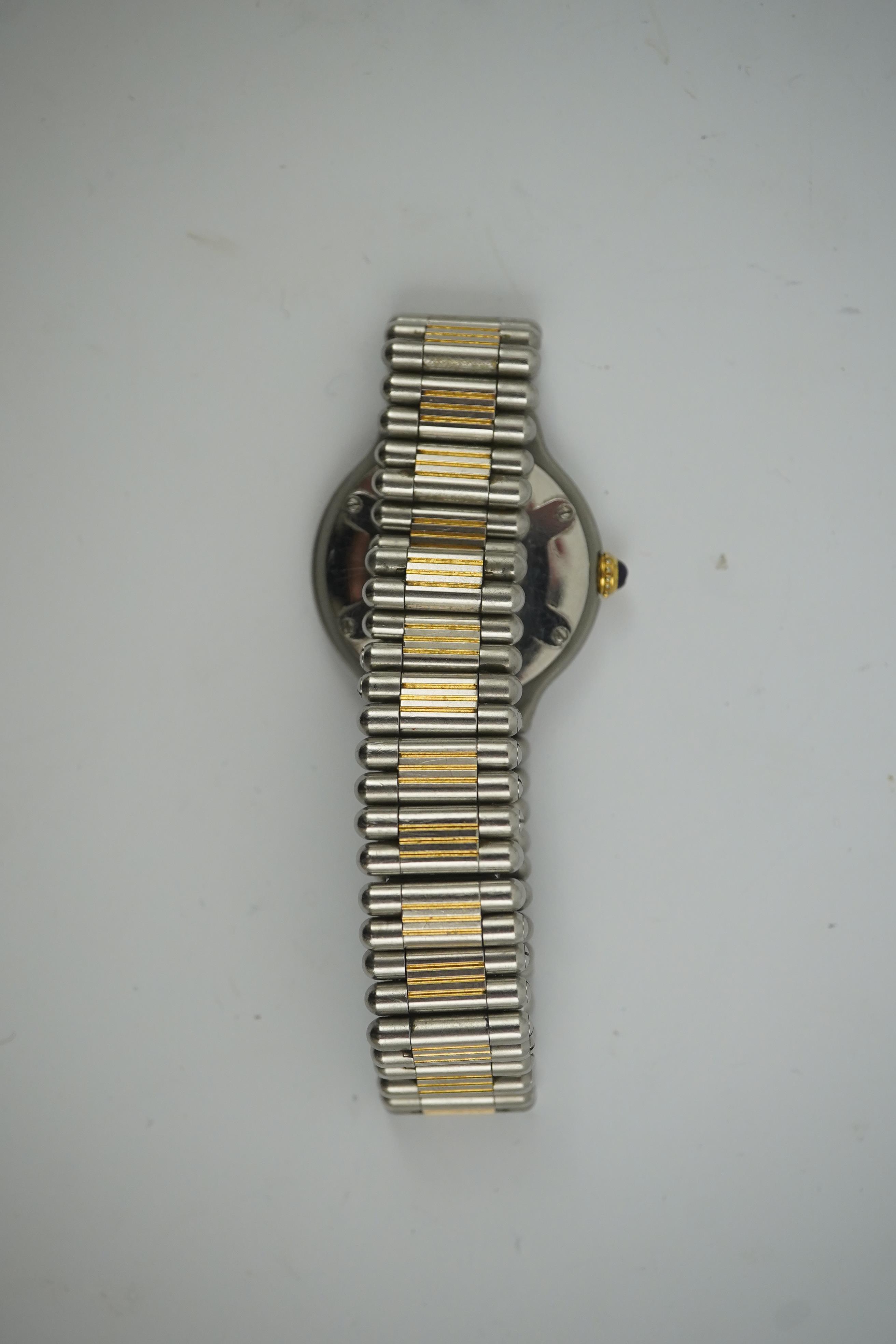 A lady's steel and gold plated Must De Cartier quartz wrist watch, on a steel and gold plated Must De Cartier bracelet